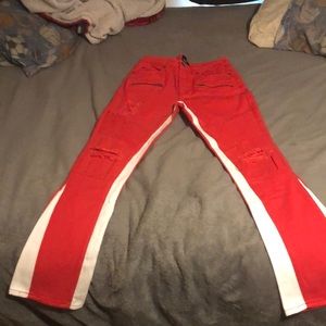 Red and white striped ripped skinny jeans.